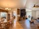 Open-concept living space with dining area, wood floors, and plenty of natural light at 3104 E Broadway Rd # 212, Mesa, AZ 85204