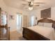 Spacious main bedroom with a ceiling fan, decorative accents, and neutral decor at 3104 E Broadway Rd # 212, Mesa, AZ 85204