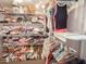 Organized walk-in closet featuring wire shelving with clothes, shoes, and decorative storage at 3104 E Broadway Rd # 212, Mesa, AZ 85204