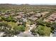 Aerial view of community showcasing single-Gathering homes, green spaces, walking trails, and playground at 31703 N 15Th Dr, Phoenix, AZ 85085