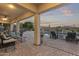 Expansive covered patio with desert landscaping, a pool, and comfortable seating arrangements at 31703 N 15Th Dr, Phoenix, AZ 85085