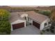 Stunning desert home with a tile roof, two garages, and beautiful landscaping at 31703 N 15Th Dr, Phoenix, AZ 85085