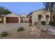 Charming desert home with tile roof, two garages and stone accents at 31703 N 15Th Dr, Phoenix, AZ 85085