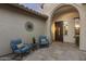 Inviting front porch with seating and beautiful desert view at 31703 N 15Th Dr, Phoenix, AZ 85085