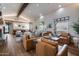 Inviting community living room featuring cozy seating, wood flooring and an abundance of natural light at 31703 N 15Th Dr, Phoenix, AZ 85085
