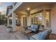 Covered patio with desert landscaping and comfortable seating at 31703 N 15Th Dr, Phoenix, AZ 85085