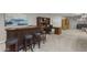 Recreation room featuring a bar, office space, and comfortable seating at 31703 N 15Th Dr, Phoenix, AZ 85085