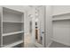 A spacious walk-in closet that features rod and shelf storage at 31703 N 15Th Dr, Phoenix, AZ 85085