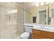 Modern bathroom featuring a glass shower, toilet, sink with vanity and a large mirror at 3207 E Behrend Dr, Phoenix, AZ 85050