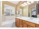 Bright bathroom featuring a double vanity sink and a large window for natural light at 3207 E Behrend Dr, Phoenix, AZ 85050