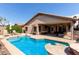 Inviting pool with sundeck, shaded patio, and lounge seating create a relaxing outdoor oasis at 3207 E Behrend Dr, Phoenix, AZ 85050