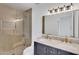Beautiful bathroom with marble countertop, dual sinks, glass enclosed shower with detailed tile flooring at 3307 N Apollo Dr, Chandler, AZ 85224