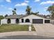 Attractive single-story home boasting a well-manicured lawn, arched windows, and an attached two-car garage at 3307 N Apollo Dr, Chandler, AZ 85224
