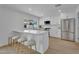 Modern kitchen featuring stainless steel appliances, white cabinets, and barstool seating at 3307 N Apollo Dr, Chandler, AZ 85224
