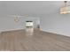 Spacious living room with new laminate flooring and modern light fixtures at 3307 N Apollo Dr, Chandler, AZ 85224