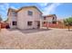 Large backyard with neutral gravel and covered patio, perfect for outdoor living at 3421 S 256Th Ave, Buckeye, AZ 85326