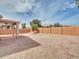 Expansive gravel backyard with block wall fencing providing privacy at 3421 S 256Th Ave, Buckeye, AZ 85326