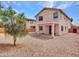 Spacious backyard featuring a covered patio and low-maintenance gravel landscaping at 3421 S 256Th Ave, Buckeye, AZ 85326