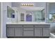 Bright bathroom boasts dual sinks, a large mirror, and a tiled shower with glass door for a spa-like feel at 3421 S 256Th Ave, Buckeye, AZ 85326