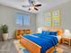Bright bedroom features stylish decor, a plush bed with colorful bedding, and neutral walls for a cozy retreat at 3421 S 256Th Ave, Buckeye, AZ 85326