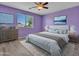 Comfortable bedroom with a ceiling fan and nice natural light at 3421 S 256Th Ave, Buckeye, AZ 85326