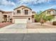 Two-story home featuring a balcony, a two-car garage and low-maintenance desert landscaping at 3421 S 256Th Ave, Buckeye, AZ 85326