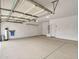 Spacious two-car garage with concrete flooring, overhead lighting, and water filtration system at 3421 S 256Th Ave, Buckeye, AZ 85326