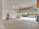 Spacious two-car garage with concrete flooring, overhead lighting, and room for storage at 3421 S 256Th Ave, Buckeye, AZ 85326