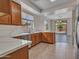 Spacious kitchen featuring wood cabinets, stainless steel appliances, and light countertops with an open floorplan at 3421 S 256Th Ave, Buckeye, AZ 85326