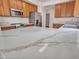 Kitchen island with white marble countertops and stainless steel appliances at 3421 S 256Th Ave, Buckeye, AZ 85326