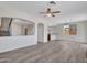 Spacious living room with wood-look flooring and an open floor plan at 3421 S 256Th Ave, Buckeye, AZ 85326
