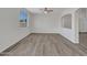 Open-concept living room with neutral paint and lots of natural light at 3421 S 256Th Ave, Buckeye, AZ 85326