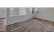 Open living area with hardwood floors, abundant natural light, and view to the upper level at 3421 S 256Th Ave, Buckeye, AZ 85326