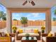 Beautiful outdoor patio with comfortable seating and a view of the landscaped backyard at 3421 S 256Th Ave, Buckeye, AZ 85326