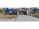 Charming single Gathering home featuring desert landscaping, neutral paint colors, and an attached two car garage at 35566 N Breezy Ln, San Tan Valley, AZ 85140