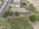 Aerial view showcases backyard, complete with landscaping, a patio, and an inviting pergola at 35624 N Zachary Rd, San Tan Valley, AZ 85144