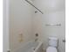 Cozy bathroom with a standard bathtub and shower combination, alongside a toilet and towel rack at 35624 N Zachary Rd, San Tan Valley, AZ 85144