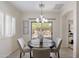 Dining area with a round table and sliding glass doors leading to the patio at 35624 N Zachary Rd, San Tan Valley, AZ 85144