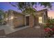 Exterior view of a single-Gathering home featuring stone accents and a welcoming front porch at 35624 N Zachary Rd, San Tan Valley, AZ 85144