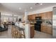 Open concept kitchen with breakfast bar and views into the living area at 35624 N Zachary Rd, San Tan Valley, AZ 85144