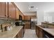 Kitchen featuring wood cabinets, stainless steel appliances and tile backsplash at 35624 N Zachary Rd, San Tan Valley, AZ 85144