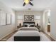 Main bedroom with a ceiling fan, ensuite bathroom, and plenty of natural light at 35624 N Zachary Rd, San Tan Valley, AZ 85144