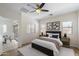 Spacious main bedroom with ensuite bathroom and views into the dining area at 35624 N Zachary Rd, San Tan Valley, AZ 85144