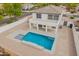 An aerial view of the backyard featuring a beautiful pool, and covered patio, showcasing the property's outdoor space at 3841 E Esplanade Ave, Gilbert, AZ 85297