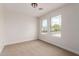 Bright and airy bedroom with neighborhood views from two windows and neutral carpeting, ready for customization at 3841 E Esplanade Ave, Gilbert, AZ 85297