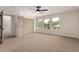 Bright bedroom with natural light, large closet, and neutral carpet flooring, creating a relaxing retreat at 3841 E Esplanade Ave, Gilbert, AZ 85297
