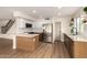 Open-concept kitchen with a large island, stainless steel appliances, and modern finishes, perfect for cooking and entertaining at 3841 E Esplanade Ave, Gilbert, AZ 85297