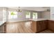 Bright, open living area with modern finishes, hardwood floors, and sliding glass doors leading to the outdoor space at 3841 E Esplanade Ave, Gilbert, AZ 85297