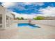 Beautiful backyard pool surrounded by pavers and a concrete patio, perfect for outdoor entertaining at 3841 E Esplanade Ave, Gilbert, AZ 85297