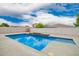 Inviting backyard pool with blue tile surrounded by concrete, a refreshing oasis for relaxation and recreation at 3841 E Esplanade Ave, Gilbert, AZ 85297